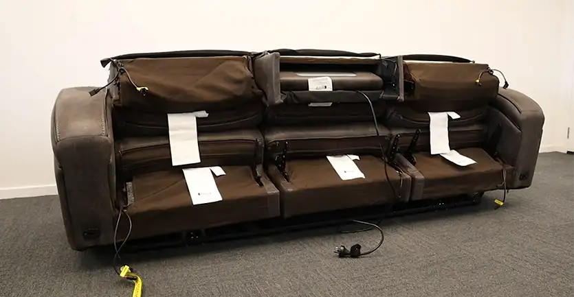 A 3-seater lounge suite partway through being assembled